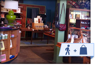 local boutique store interior with walk and shop local banner